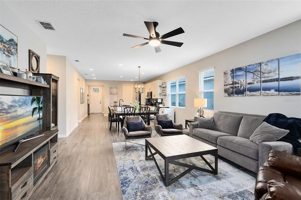 Chandelier, Dining room, Fireplace, Interior, Kitchen, Living room, Pendant Lights, Recessed Lighting, Wood Texture Flooring