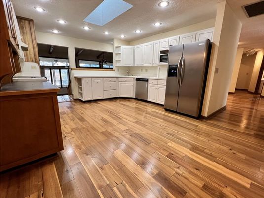 Interior, Kitchen, Recessed Lighting, Stainless Steel Appliances, Wood Texture Flooring