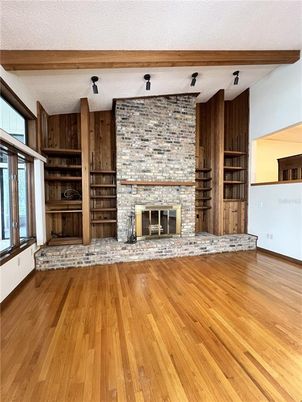 Empty room, Fireplace, Interior, Stone Walls, Wooden Beams, Wood Texture Flooring