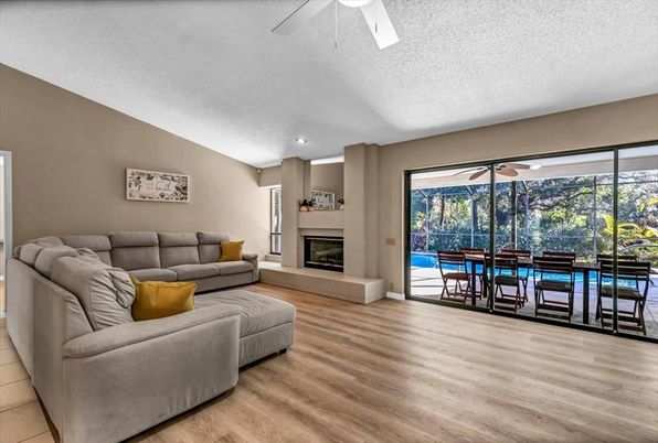 Dining room, Fireplace, Interior, Living room, Recessed Lighting, Wood Texture Flooring