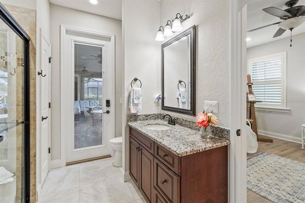 Bathroom, Dual Sink Vanities, Glass Shower, Interior, Recessed Lighting, Wood Texture Flooring