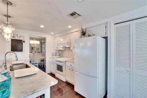 Chandelier, Interior, Kitchen, Recessed Lighting, Stainless Steel Appliances, Wood Texture Flooring