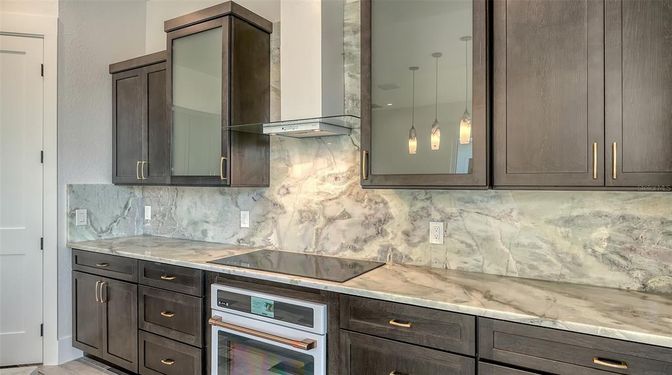 Interior, Kitchen, Marble Walls, Pendant Lights, Stainless Steel Appliances