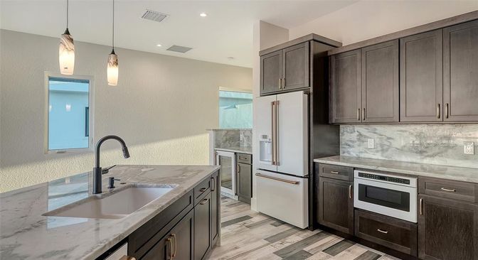 Interior, Kitchen, Pendant Lights, Recessed Lighting, Stainless Steel Appliances, Wood Texture Flooring