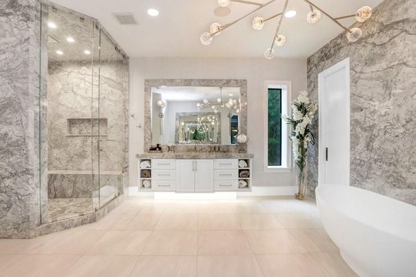 Bathroom, Dual Sink Vanities, Free Standing Baths, Glass Shower, Interior, Marble Walls, Pendant Lights, Recessed Lighting