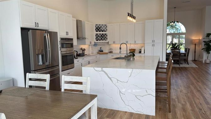 Dining room, Interior, Kitchen, Pendant Lights, Stainless Steel Appliances, Wood Texture Flooring
