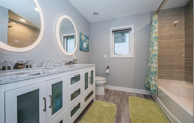 Bathroom, Dual Sink Vanities, Interior, Recessed Lighting, Wood Texture Flooring