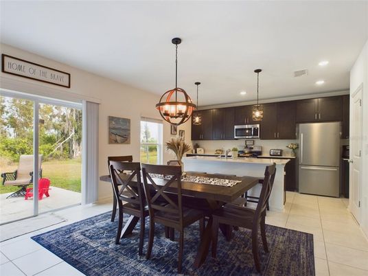 Chandelier, Dining room, Interior, Kitchen, Pendant Lights, Recessed Lighting, Stainless Steel Appliances