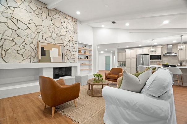 Fireplace, Interior, Kitchen, Living room, Pendant Lights, Recessed Lighting, Stainless Steel Appliances, Stone Walls, Wood Texture Flooring