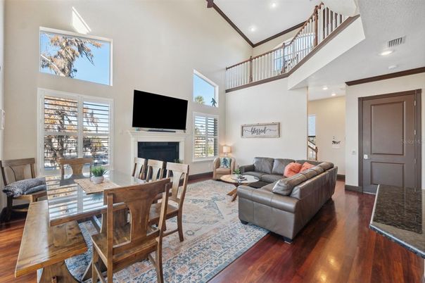 Dining room, Fireplace, Interior, Living room, Recessed Lighting, Wood Texture Flooring