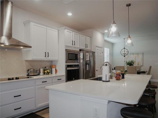 Dining room, Interior, Kitchen, Pendant Lights, Recessed Lighting, Stainless Steel Appliances, Wood Texture Flooring