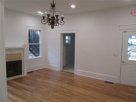 Chandelier, Empty room, Fireplace, Interior, Recessed Lighting, Wood Texture Flooring