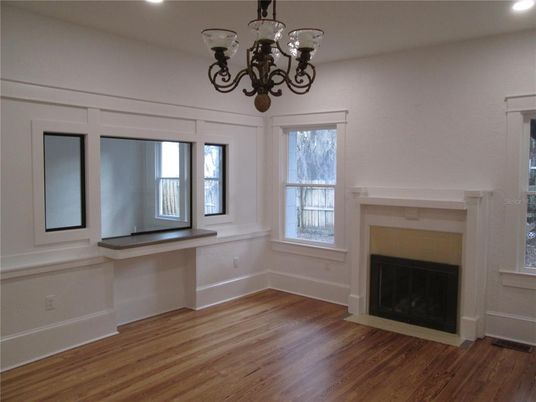 Chandelier, Empty room, Fireplace, Interior, Recessed Lighting, Wood Texture Flooring