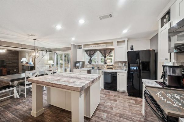 Chandelier, Dining room, Interior, Kitchen, Pendant Lights, Recessed Lighting, Stainless Steel Appliances, Wood Texture Flooring