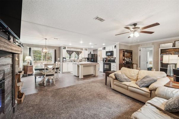 Dining room, Fireplace, Interior, Kitchen, Living room, Pendant Lights, Recessed Lighting, Stainless Steel Appliances, Wood Texture Flooring