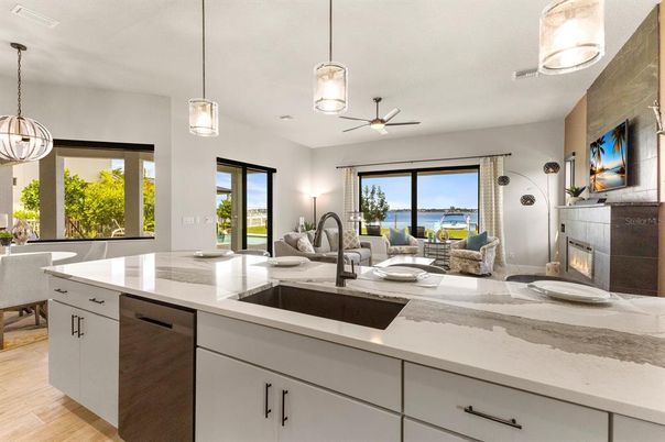Dining room, Fireplace, Interior, Kitchen, Living room, Pendant Lights, Water, Wood Texture Flooring