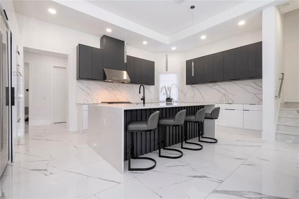 Interior, Kitchen, Marble, Marble Walls, Pendant Lights, Recessed Lighting, Stainless Steel Appliances