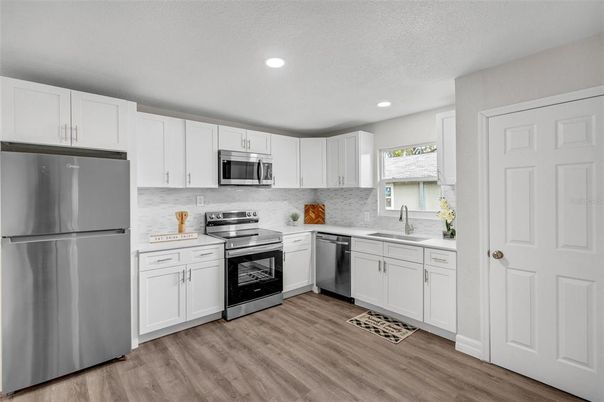 Interior, Kitchen, Recessed Lighting, Stainless Steel Appliances, Wood Texture Flooring