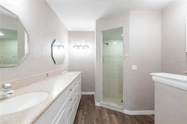 Bathroom, Dual Sink Vanities, Glass Shower, Interior, Wood Texture Flooring