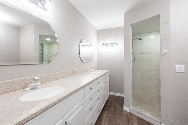 Bathroom, Dual Sink Vanities, Glass Shower, Interior, Wood Texture Flooring