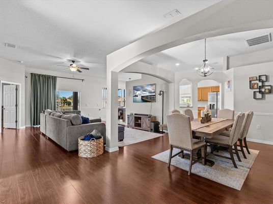 Chandelier, Dining room, Fireplace, Interior, Living room, Pendant Lights, Recessed Lighting, Wood Texture Flooring