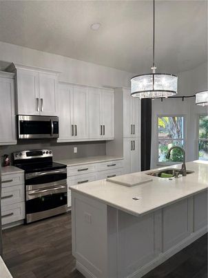 Chandelier, Interior, Kitchen, Pendant Lights, Recessed Lighting, Stainless Steel Appliances, Wood Texture Flooring