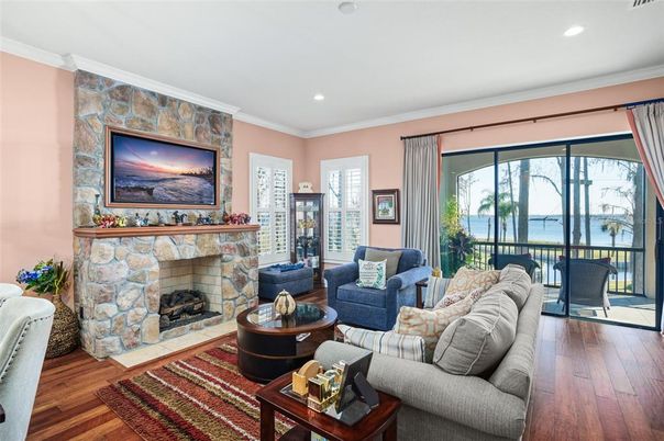 Fireplace, Interior, Living room, Recessed Lighting, Stone Walls, Water, Wood Texture Flooring