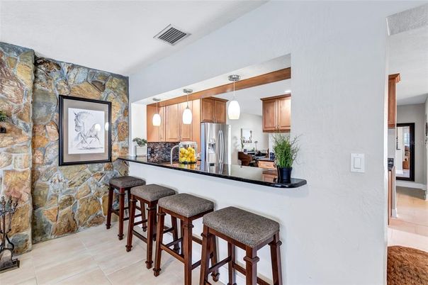 Interior, Kitchen, Pendant Lights, Stainless Steel Appliances, Stone Walls
