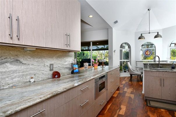 Dining room, Interior, Kitchen, Pendant Lights, Recessed Lighting, Stainless Steel Appliances, Wood Texture Flooring