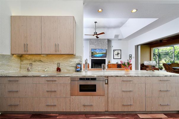 Fireplace, Interior, Kitchen, Recessed Lighting, Stainless Steel Appliances, Stone Walls, Wood Texture Flooring