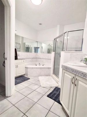 Bathroom, Dual Sink Vanities, Glass Shower, Interior, Recessed Lighting, Tile Countertops
