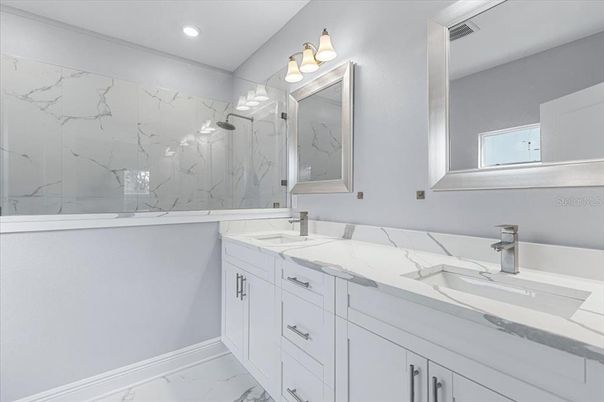 Bathroom, Dual Sink Vanities, Glass Shower, Interior, Marble, Marble Walls, Recessed Lighting