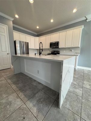 Interior, Kitchen, Marble Walls, Recessed Lighting, Stainless Steel Appliances