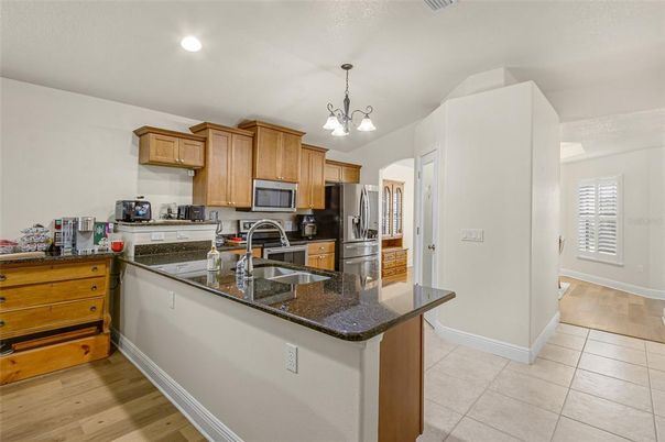 Chandelier, Interior, Kitchen, Pendant Lights, Recessed Lighting, Stainless Steel Appliances, Wood Texture Flooring