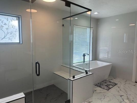 Bathroom, Free Standing Baths, Glass Shower, Interior, Marble, Marble Walls, Recessed Lighting