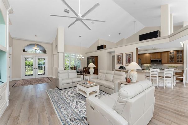 Chandelier, Dining room, Interior, Kitchen, Living room, Pendant Lights, Recessed Lighting, Stainless Steel Appliances, Wood Texture Flooring