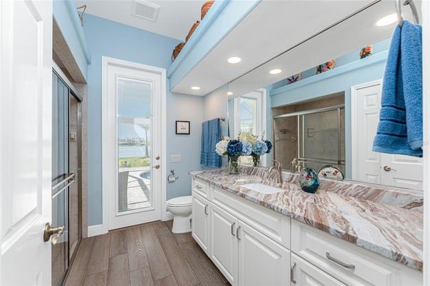Bathroom, Dual Sink Vanities, Interior, Recessed Lighting, Wood Texture Flooring
