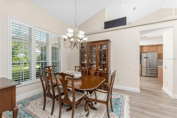 Chandelier, Dining room, Interior, Kitchen, Recessed Lighting, Stainless Steel Appliances, Wood Texture Flooring