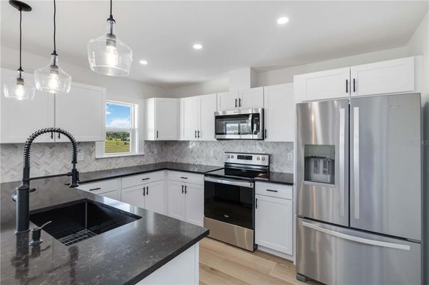 Interior, Kitchen, Pendant Lights, Recessed Lighting, Stainless Steel Appliances, Wood Texture Flooring
