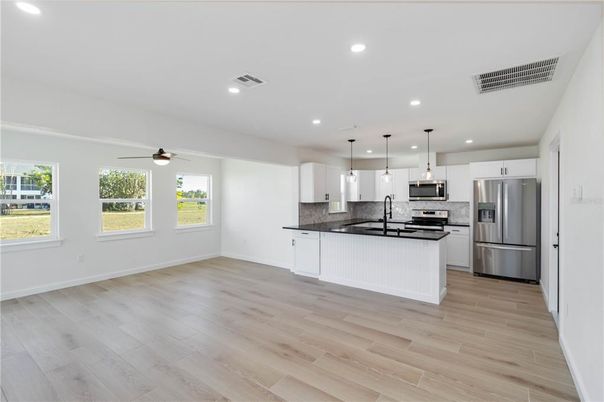 Interior, Kitchen, Pendant Lights, Recessed Lighting, Stainless Steel Appliances, Wood Texture Flooring