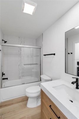 Bathroom, Glass Shower, Interior, Marble Walls, Wood Texture Flooring