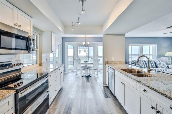 Chandelier, Dining room, Interior, Kitchen, Pendant Lights, Stainless Steel Appliances, Wood Texture Flooring
