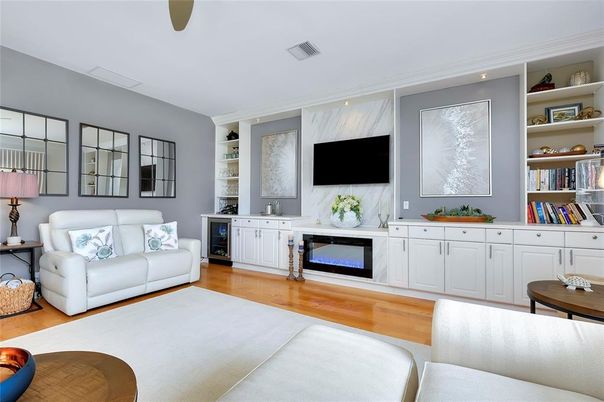 Fireplace, Interior, Living room, Marble Walls, Recessed Lighting, Wood Texture Flooring