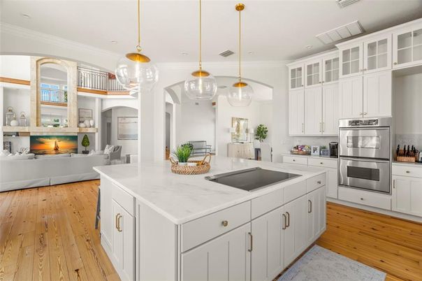Fireplace, Interior, Kitchen, Living room, Pendant Lights, Recessed Lighting, Stainless Steel Appliances, Wood Texture Flooring