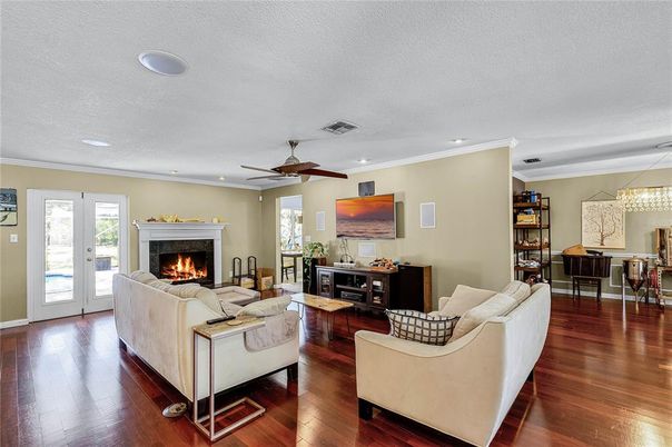 Dining room, Fireplace, Interior, Living room, Pendant Lights, Recessed Lighting, Wood Texture Flooring