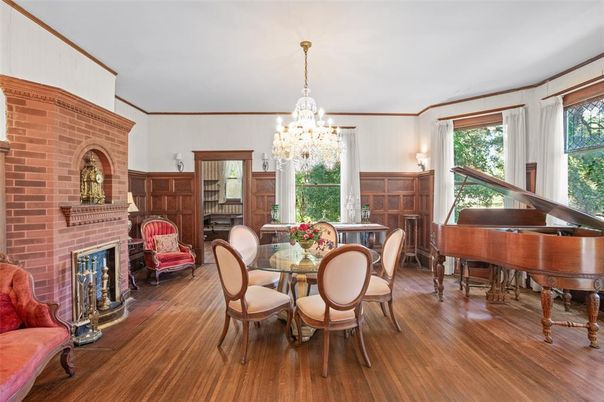 Chandelier, Dining room, Fireplace, Interior, Piano, Stone Walls, Wood Texture Flooring