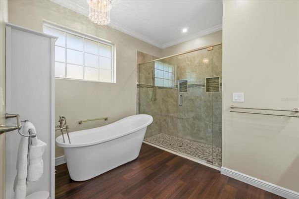Bathroom, Chandelier, Free Standing Baths, Glass Shower, Interior, Recessed Lighting, Wood Texture Flooring