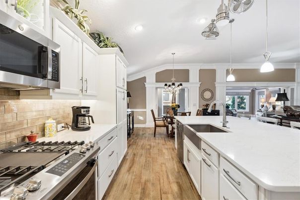 Dining room, Interior, Kitchen, Pendant Lights, Recessed Lighting, Stainless Steel Appliances, Wood Texture Flooring