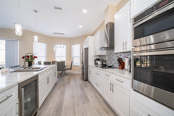 Dining room, Interior, Kitchen, Pendant Lights, Recessed Lighting, Stainless Steel Appliances, Wood Texture Flooring