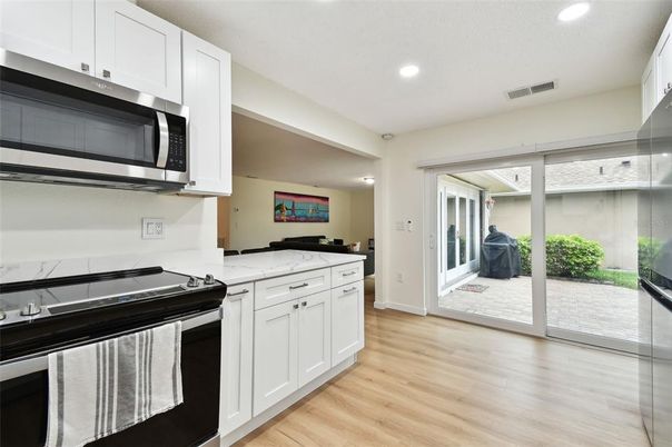 Interior, Kitchen, Recessed Lighting, Stainless Steel Appliances, Wood Texture Flooring